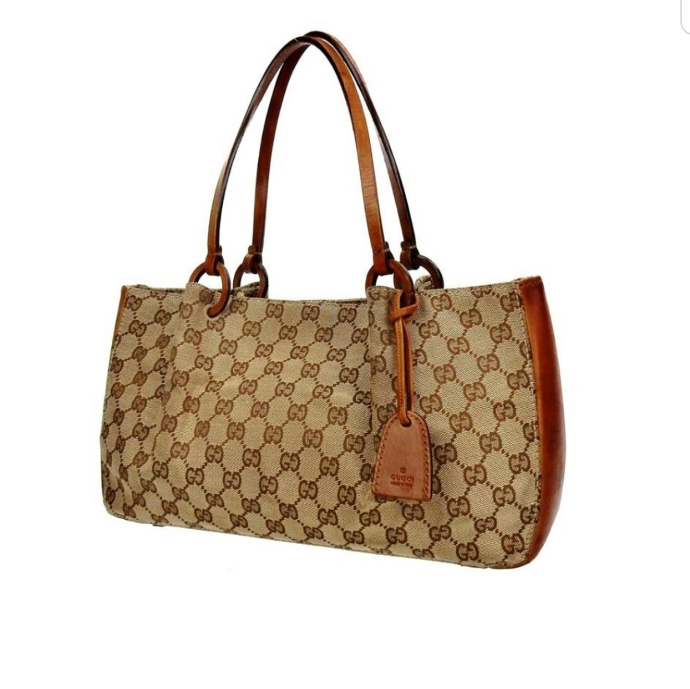 Authentic Gucci Carry all Monogram  Canvas w/poche